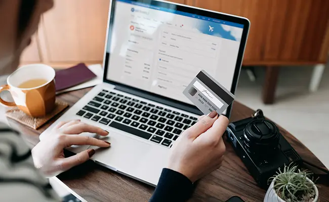 woman on laptop with credit card